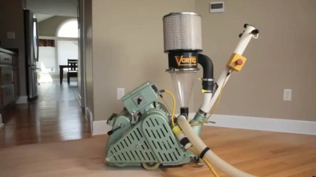 Dustless hardwood floor sanding machine in a residential setting, showcasing clean hardwood floors and a modern interior design, emphasizing the dustless refinishing process.