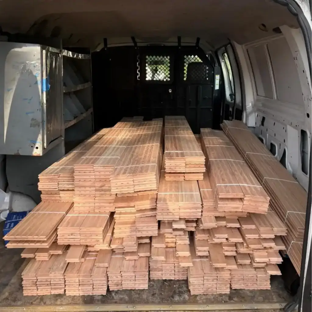 Stacked wooden planks in van