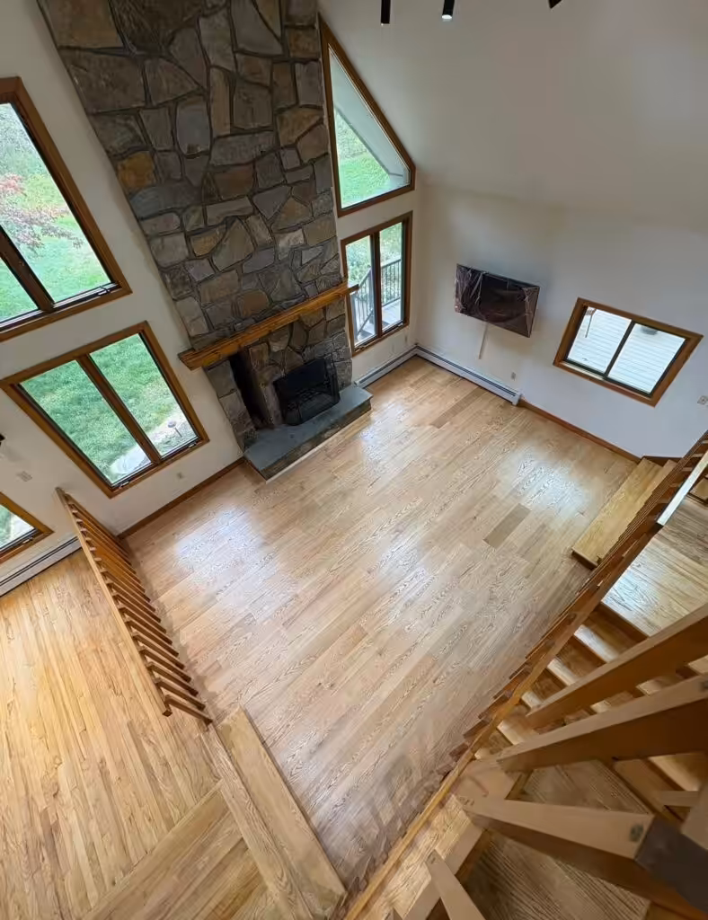 Spacious living room with stone fireplace