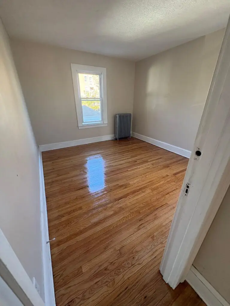 Empty room with polished wooden floor